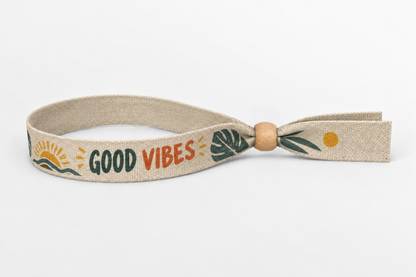 Bēša kokvilnas aproce ar krāsainu Good Vibes apdruku