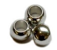 Close-up of a silver metal bead with a textured surface.