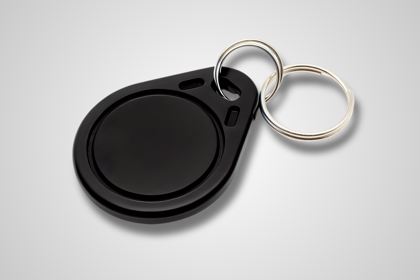 JM Band® NFC atslēgu piekariņa fotoattēls. Iegādājieties RFID melnā krāsā šeit.