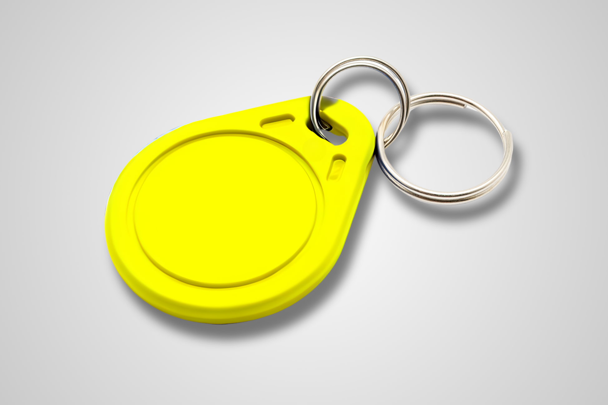 JM Band® NFC atslēgu piekariņa fotoattēls. Iegādājieties RFID dzeltenā krāsā šeit.
